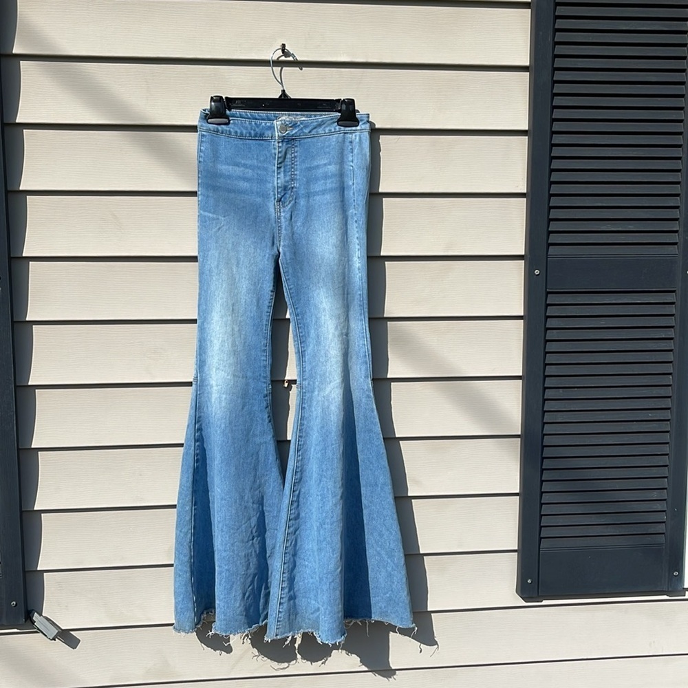 Free People - light medium wash hi-rise blue jeans - large flare - size 24